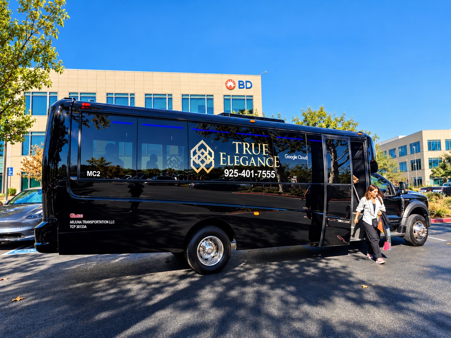 Passenger boarding a black True Elegance Grech executive shuttle at an office campus; Bay Area fleet option for San Francisco limo service and corporate group transportation