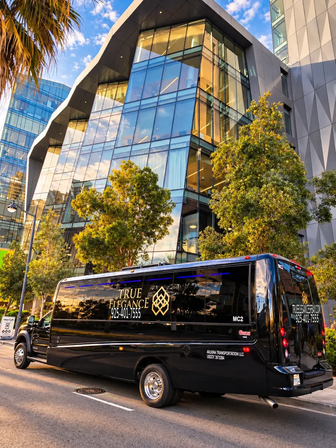 Locally operated Bay Area corporate shuttle fleet True Elegance black executive shuttle beside a glass-fronted office building