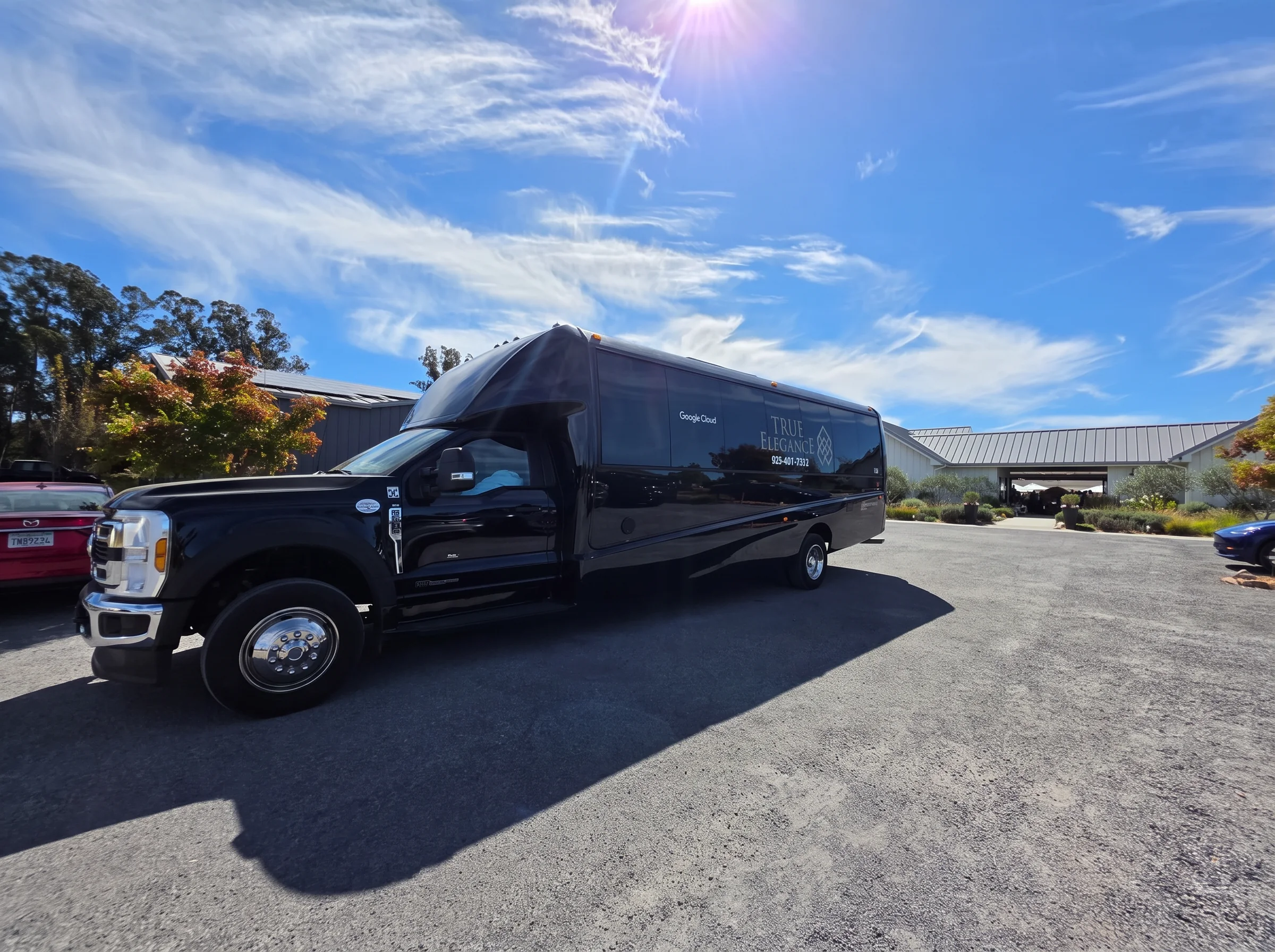 Executive shuttle for Pebble Beach hospitality Black True Elegance executive shuttle bus serving a private Pebble Beach hospitality event